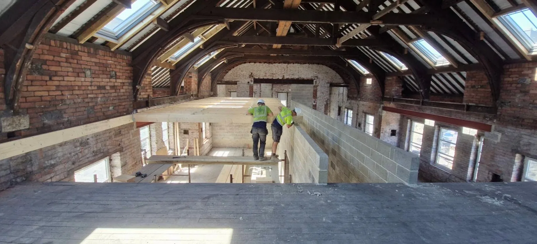 Wilson-Kaye team working inside a large building renovation project